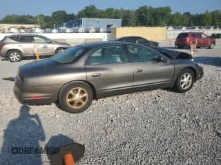 ✅ 1999 Oldsmobile Aurora • VIN: 1G3GR62CXX4119238 • Lot: 68432415. Wystawiony na Copart z przebiegiem 107 576 mil. Bezpłatny archiwum sprzedaży aukcyjnych z USA i szczegółowy raport historii pojazdu na DreamBid. Zdjęcie 3.