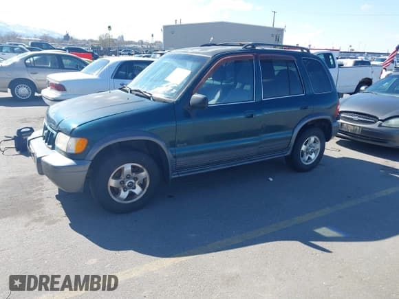 ✅ 2002 Kia Sportage • VIN: KNDJA723925120001 • Lot: 41931419. Listed on IAAI with 145,675 mi. Free auction sales archive from the USA and detailed vehicle history report at DreamBid. Image 2.