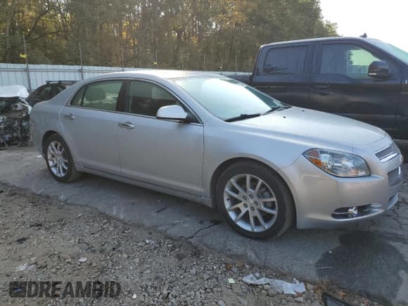 ✅ 2012 Chevrolet Malibu LTZ • VIN: 1G1ZG5E79CF288942 • Lot: 77530494. Listed on Copart with 135,863 mi. Free auction sales archive from the USA and detailed vehicle history report at DreamBid. Image 4.