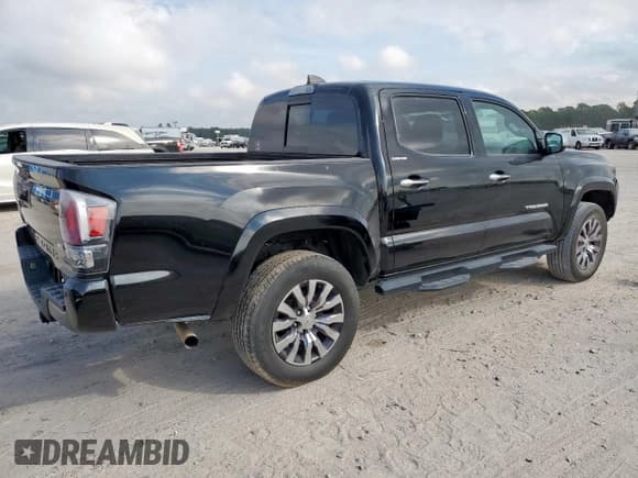 ✅ 2023 Toyota Tacoma Limited • VIN: 3TMEZ5CN3PM200460 • Лот: 93877885. Опубликован ранее на Copart с пробегом 59 605 миль. Бесплатный доступ к архиву аукционных продаж из США и подробный отчёт об истории автомобиля на DreamBid. Изображение 3.
