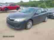 2012 Toyota Camry XLE z VIN 4T1BD1FK9CU019103, wystawiony jako IAAI lot #42984668 z przebiegiem 228 607 mil mil oraz . Historia ofert i sprzedaży dostępna na DreamBid. Obrazek 2.