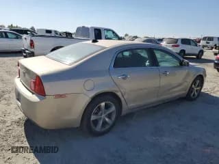 ✅ 2012 Chevrolet Malibu 1LT • VIN: 1G1ZC5E05CF112131 • Lot: 64055834. Listed on Copart with 142,432 mi. Free auction sales archive from the USA and detailed vehicle history report at DreamBid. Image 3.