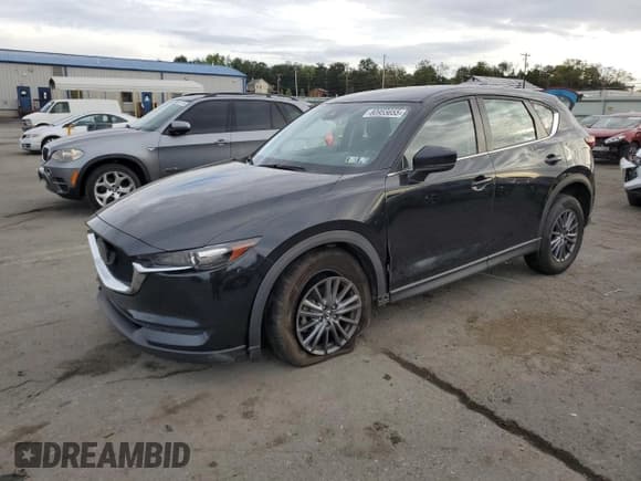 ✅ 2021 Mazda CX-5 Sport • VIN: JM3KFBBM7M0350581 • Лот: 80955655. Опубликован ранее на Copart с пробегом 56 344 миль. Бесплатный доступ к архиву аукционных продаж из США и подробный отчёт об истории автомобиля на DreamBid. Изображение 1.
