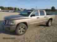 2010 Dodge Dakota Bighorn/Lonestar with VIN 1D7CW3GK4AS199621, listed as a Copart auction lot 77797454 with 150,850 mi miles and Salvage title. Bid and sale history available at DreamBid. Image 1.
