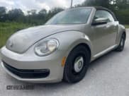 ✅ 2013 Volkswagen Beetle 2.5L • VIN: 3VW5X7AT2DM825928 • Lot: 66500855. Listed on Copart with 48,795 mi. Free auction sales archive from the USA and detailed vehicle history report at DreamBid. Image 2.