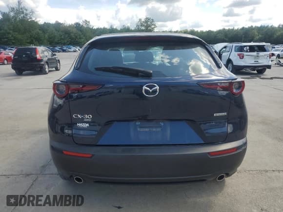 ✅ 2023 Mazda CX-30 S • VIN: 3MVDMBAM3PM512179 • Lot: 64998075. Wystawiony na Copart z przebiegiem 9 767 mil. Bezpłatny archiwum sprzedaży aukcyjnych z USA i szczegółowy raport historii pojazdu na DreamBid. Zdjęcie 6.