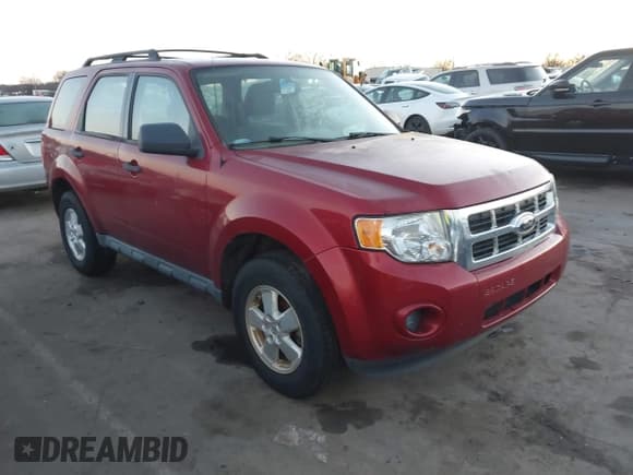 ✅ 2012 Ford Escape XLS • VIN: 1FMCU0C79CKC36595 • Lot: 41088393. Listed on IAAI with 184,927 mi. Free auction sales archive from the USA and detailed vehicle history report at DreamBid. Image 1.