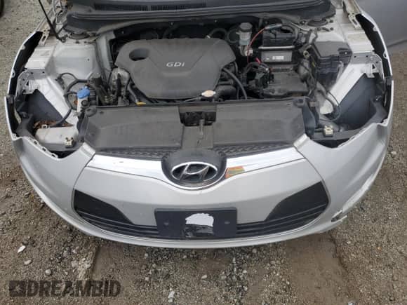 2012 Hyundai Veloster w/Red Int z VIN KMHTC6AD2CU021143, wystawiony jako Copart lot #44055345 z przebiegiem Nie podano mil oraz Czysty tytuł • Clean title. Historia ofert i sprzedaży dostępna na DreamBid. Obrazek 11.