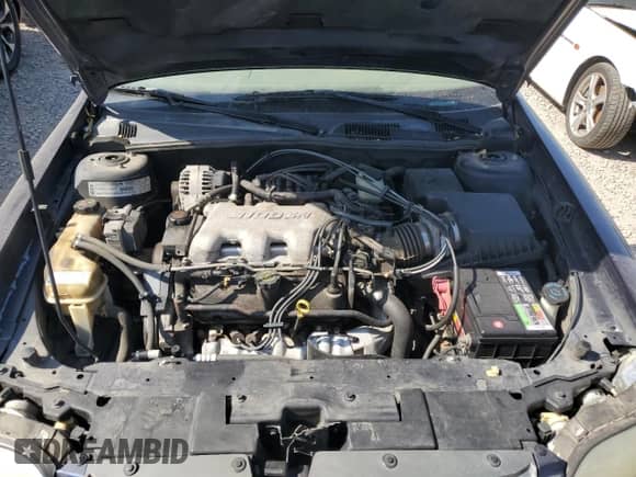 2001 Chevrolet Malibu LS z VIN 1G1NE52J616121147, wystawiony jako Copart lot #74778684 z przebiegiem 186 946 mil mil oraz Szkoda całkowita • Salvage title. Historia ofert i sprzedaży dostępna na DreamBid. Obrazek 13.