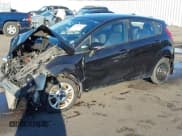 ✅ 2014 Ford Fiesta SE • VIN: 3FADP4EJ6EM133880 • Lot: 43387604. Wystawiony na IAAI z przebiegiem 93 640 mil. Bezpłatny archiwum sprzedaży aukcyjnych z USA i szczegółowy raport historii pojazdu na DreamBid. Zdjęcie 2.