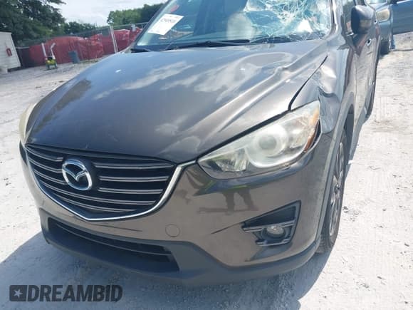 ✅ 2016 Mazda CX-5 Grand Touring • VIN: JM3KE2DY7G0782899 • Lot: 42949510. Wystawiony na IAAI z przebiegiem 85 502 mil. Bezpłatny archiwum sprzedaży aukcyjnych z USA i szczegółowy raport historii pojazdu na DreamBid. Zdjęcie 6.
