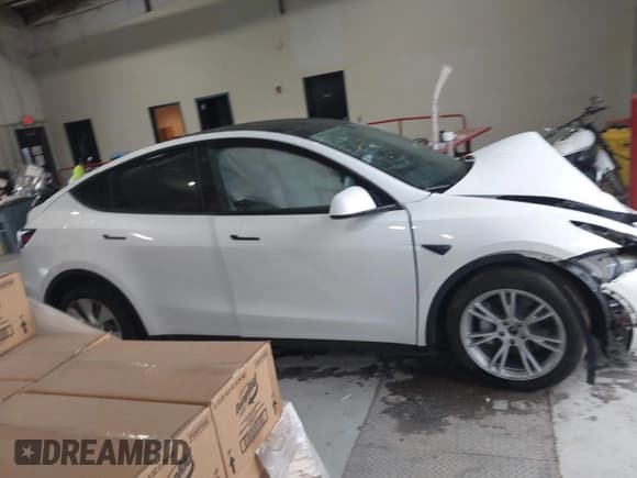 ✅ 2023 Tesla Model Y Long Range • VIN: 7SAYGAEEXPF789037 • Lot: 41551605. Listed on IAAI with 8,630 mi. Free auction sales archive from the USA and detailed vehicle history report at DreamBid. Image 13.