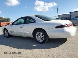 ✅ 1997 Lincoln Mark VIII • VIN: 1LNLM91V5VY659180 • Lot: 74809954. Listed on Copart with 121,085 mi. Free auction sales archive from the USA and detailed vehicle history report at DreamBid. Image 2.