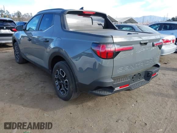 2023 Hyundai Santa Cruz SEL z VIN 5NTJC4AE5PH071917, wystawiony jako IAAI lot #41249984 z przebiegiem 14 703 mil mil oraz . Historia ofert i sprzedaży dostępna na DreamBid. Obrazek 3.