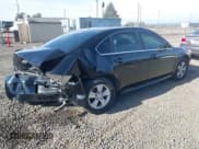 ✅ 2014 Chevrolet Impala LS • VIN: 2G1WA5E33E1140331 • Lot: 43507195. Listed on IAAI with 102,299 mi. Free auction sales archive from the USA and detailed vehicle history report at DreamBid. Image 4.