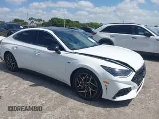 2023 Hyundai Sonata N Line with VIN KMHL14JC8PA306230, listed as a IAAI auction lot 42104242 with 25,901 mi miles and . Bid and sale history available at DreamBid. Image 1.