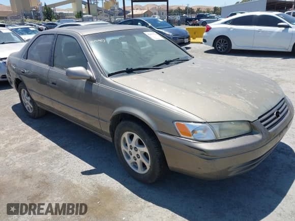 ✅ 1999 Toyota Camry LE • VIN: JT2BF22K4X0154070 • Lot: 42672776. Listed on IAAI with 228,295 mi. Free auction sales archive from the USA and detailed vehicle history report at DreamBid. Image 1.