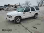 2003 Chevrolet Blazer LS z VIN 1GNDT13X63K170578, wystawiony jako Copart lot #86630144 z przebiegiem 105 749 mil mil oraz Szkoda całkowita • Salvage title. Historia ofert i sprzedaży dostępna na DreamBid. Obrazek 1.