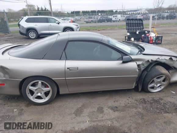 1999 Chevrolet Camaro z VIN 2G1FP22K2X2116432, wystawiony jako IAAI lot #41931771 z przebiegiem 124 879 mil mil oraz . Historia ofert i sprzedaży dostępna na DreamBid. Obrazek 13.