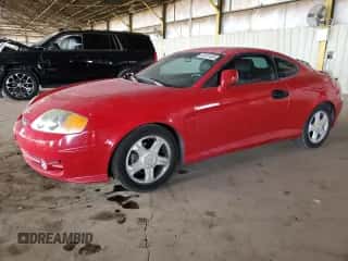 2003 Hyundai Tiburon GT z VIN KMHHN65F53U086483, wystawiony jako Copart lot #53391495 z przebiegiem 153 544 mil mil oraz Szkoda całkowita • Salvage title. Historia ofert i sprzedaży dostępna na DreamBid. Obrazek 1.
