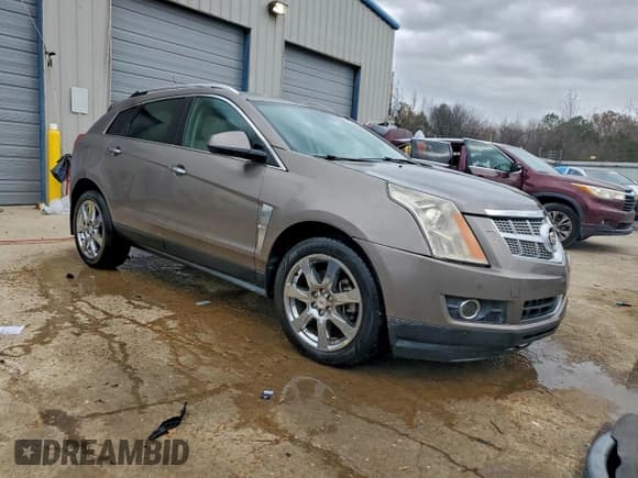 ✅ 2012 Cadillac SRX Performance Collection • VIN: 3GYFNBE37CS532590 • Lot: 94237585. Listed on Copart with 166,412 mi. Free auction sales archive from the USA and detailed vehicle history report at DreamBid. Image 4.