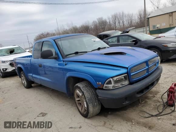 1999 Dodge Dakota Sport z VIN 1B7GL22Z7XS110023, wystawiony jako Copart lot #85889754 z przebiegiem Nie podano mil oraz Szkoda całkowita • Salvage title. Historia ofert i sprzedaży dostępna na DreamBid. Obrazek 4.