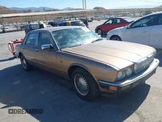 ✅ 1989 Jaguar XJ • VIN: SAJKY1548KC576361 • Lot: 42827334. Listed on IAAI with 7,914 mi. Free auction sales archive from the USA and detailed vehicle history report at DreamBid. Image 1.