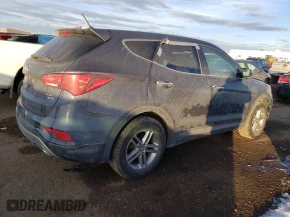 ✅ 2018 Hyundai Santa Fe 2.4L • VIN: 5XYZTDLB8JG523085 • Лот: 67651652. Опубликован ранее на Copart с пробегом 91 830 миль. Бесплатный доступ к архиву аукционных продаж из США и подробный отчёт об истории автомобиля на DreamBid. Изображение 3.