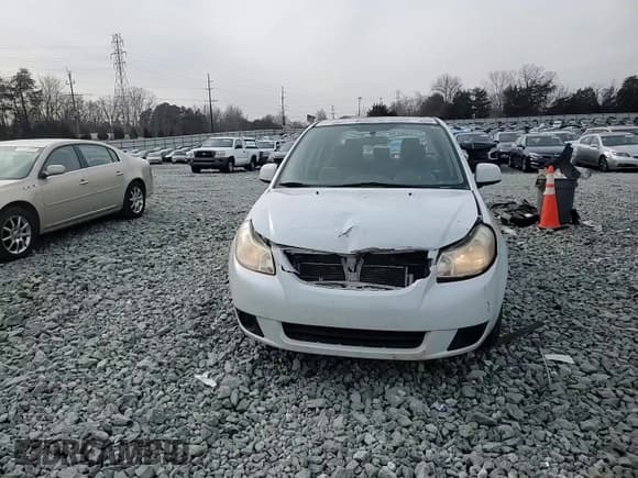 ✅ 2013 Suzuki SX4 LE • VIN: JS2YC5A37D6101979 • Лот: 42185855. Опубликован ранее на Copart с пробегом 118 855 миль. Бесплатный доступ к архиву аукционных продаж из США и подробный отчёт об истории автомобиля на DreamBid. Изображение 10.