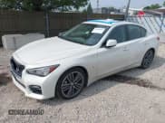 ✅ 2015 Infiniti Q50 Premium • VIN: JN1BV7AR2FM418418 • Lot: 42406682. Wystawiony na IAAI z przebiegiem 104 236 mil. Bezpłatny archiwum sprzedaży aukcyjnych z USA i szczegółowy raport historii pojazdu na DreamBid. Zdjęcie 2.