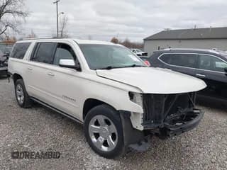 ✅ 2015 Chevrolet Suburban LTZ • VIN: 1GNSKKKC7FR290156 • Lot: 43777007. Listed on IAAI with 145,354 mi. Free auction sales archive from the USA and detailed vehicle history report at DreamBid. Image 1.