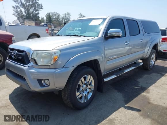 ✅ 2015 Toyota Tacoma PreRunner • VIN: 3TMKU4HN9FM045948 • Lot: 42575327. Listed on IAAI with 67,971 mi. Free auction sales archive from the USA and detailed vehicle history report at DreamBid. Image 17.