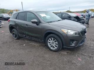 ✅ 2016 Mazda CX-5 Touring • VIN: JM3KE4CYXG0754964 • Lot: 43395097. Wystawiony na IAAI z przebiegiem 133 258 mil. Bezpłatny archiwum sprzedaży aukcyjnych z USA i szczegółowy raport historii pojazdu na DreamBid. Zdjęcie 1.
