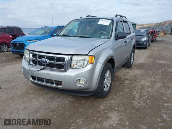 ✅ 2010 Ford Escape XLT • VIN: 1FMCU9DGXAKC45581 • Lot: 43658527. Listed on IAAI with 122,482 mi. Free auction sales archive from the USA and detailed vehicle history report at DreamBid. Image 2.