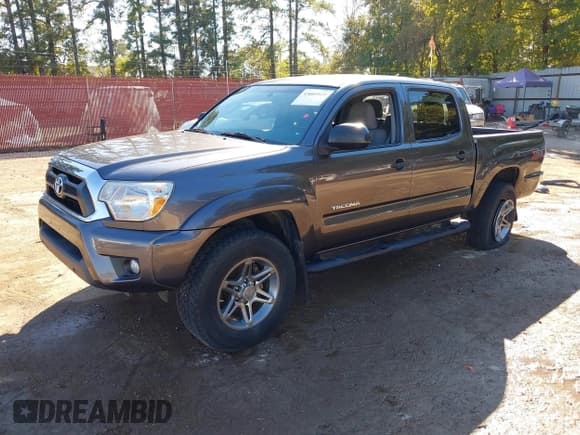 ✅ 2014 Toyota Tacoma PreRunner • VIN: 5TFJU4GN5EX058881 • Lot: 43603920. Listed on IAAI with 170,876 mi. Free auction sales archive from the USA and detailed vehicle history report at DreamBid. Image 2.