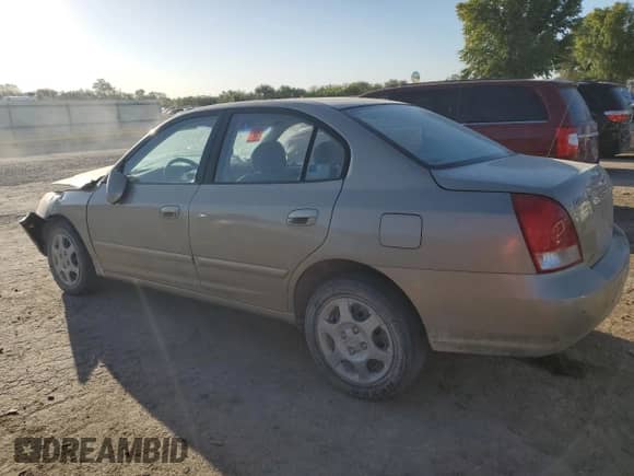 2003 Hyundai Elantra GLS z VIN KMHDN45D43U697414, wystawiony jako Copart lot #74072264 z przebiegiem Nie podano mil oraz Szkoda całkowita • Salvage title. Historia ofert i sprzedaży dostępna na DreamBid. Obrazek 2.