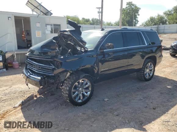 2015 Chevrolet Tahoe LTZ with VIN 1GNSKCKC6FR170659, listed as a Copart auction lot 69412835 with 252,198 mi miles and Salvage title. Bid and sale history available at DreamBid. Image 1.