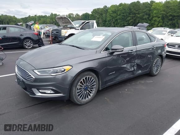 ✅ 2018 Ford Fusion Titanium • VIN: 3FA6P0RUXJR124344 • Lot: 42890852. Wystawiony na IAAI z przebiegiem 164 730 mil. Bezpłatny archiwum sprzedaży aukcyjnych z USA i szczegółowy raport historii pojazdu na DreamBid. Zdjęcie 2.
