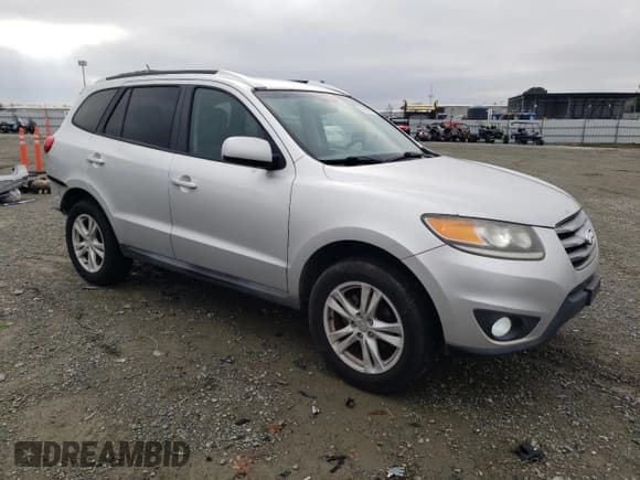 ✅ 2012 Hyundai Santa Fe SE • VIN: 5XYZHDAG7CG108357 • Lot: 85287084. Listed on Copart with 162,684 mi. Free auction sales archive from the USA and detailed vehicle history report at DreamBid. Image 4.