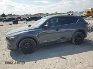 ✅ 2021 Mazda CX-5 Carbon Edition • VIN: JM3KFACY8M0342842 • Lot: 80143555. Listed on Copart with 119,608 mi. Free auction sales archive from the USA and detailed vehicle history report at DreamBid. Image 1.