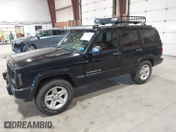 ✅ 2001 Jeep Cherokee Sport • VIN: 1J4FF58S11L562933 • Lot: 41944672. Listed on IAAI with 163,078 mi. Free auction sales archive from the USA and detailed vehicle history report at DreamBid. Image 2.