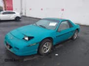 ✅ 1988 Pontiac Fiero • VIN: 1G2PE11R1JP210798 • Lot: 43472064. Wystawiony na IAAI z przebiegiem 136 233 mil. Bezpłatny archiwum sprzedaży aukcyjnych z USA i szczegółowy raport historii pojazdu na DreamBid. Zdjęcie 2.
