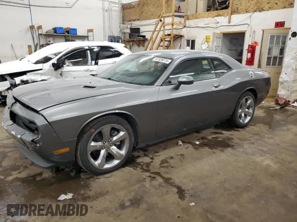 ✅ 2012 Dodge Challenger SXT Plus • VIN: 2C3CDYAG2CH259685 • Lot: 87326574. Wystawiony na Copart z przebiegiem 142 425 mil. Bezpłatny archiwum sprzedaży aukcyjnych z USA i szczegółowy raport historii pojazdu na DreamBid. Zdjęcie 1.