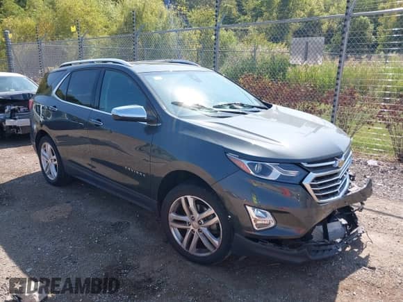 2018 Chevrolet Equinox Premier z VIN 3GNAXWEX1JS504549, wystawiony jako IAAI lot #43256484 z przebiegiem 64 262 mil mil oraz . Historia ofert i sprzedaży dostępna na DreamBid. Obrazek 1.