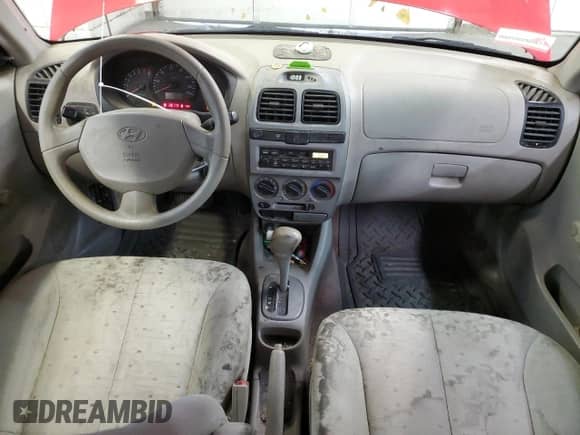 2005 Hyundai Accent GLS with VIN KMHCG45C05U661607, listed as a Copart auction lot 71812814 with 238,630 mi miles and Salvage title. Bid and sale history available at DreamBid. Image 8.