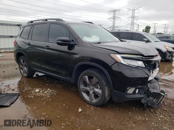 ✅ 2021 Honda Passport Touring • VIN: 5FNYF8H90MB008190 • Lot: 69515475. Listed on Copart with 61,589 mi. Free auction sales archive from the USA and detailed vehicle history report at DreamBid. Image 4.