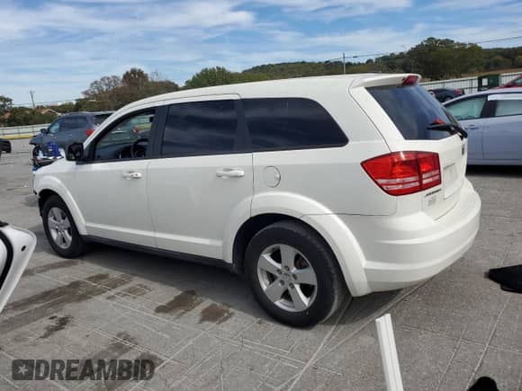 2013 Dodge Journey American Value with VIN 3C4PDCAB0DT575812, listed as a Copart auction lot 86771425 with 113,450 mi miles and Salvage title. Bid and sale history available at DreamBid. Image 2.