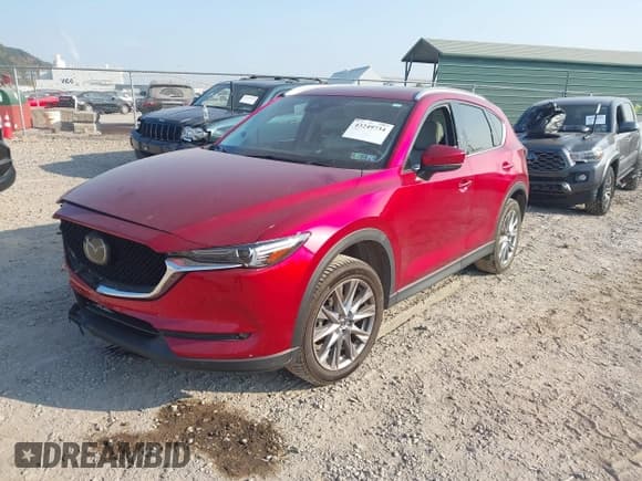 ✅ 2021 Mazda CX-5 Grand Touring • VIN: JM3KFADM2M0303871 • Lot: 43249734. Listed on IAAI with 37,748 mi. Free auction sales archive from the USA and detailed vehicle history report at DreamBid. Image 17.