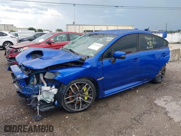 ✅ 2020 Subaru WRX STI • VIN: JF1VA2E67L9831559 • Lot: 42574564. Listed on IAAI with 67,333 mi. Free auction sales archive from the USA and detailed vehicle history report at DreamBid. Image 2.