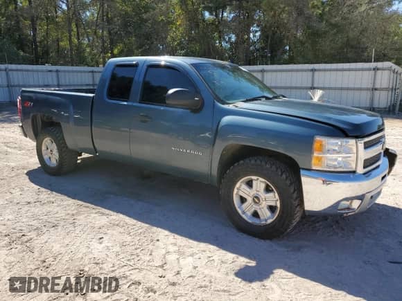2012 Chevrolet Silverado 1500 LT with VIN 1GCRCSE02CZ148654, listed as a Copart auction lot 86171285 with 218,565 mi miles and Salvage title. Bid and sale history available at DreamBid. Image 4.